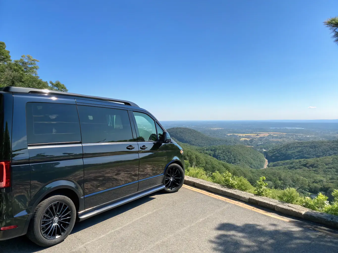 A scenic landscape featuring a campervan parked near a mountain trail, with hiking boots and a map visible, symbolizing adventure and exploration.